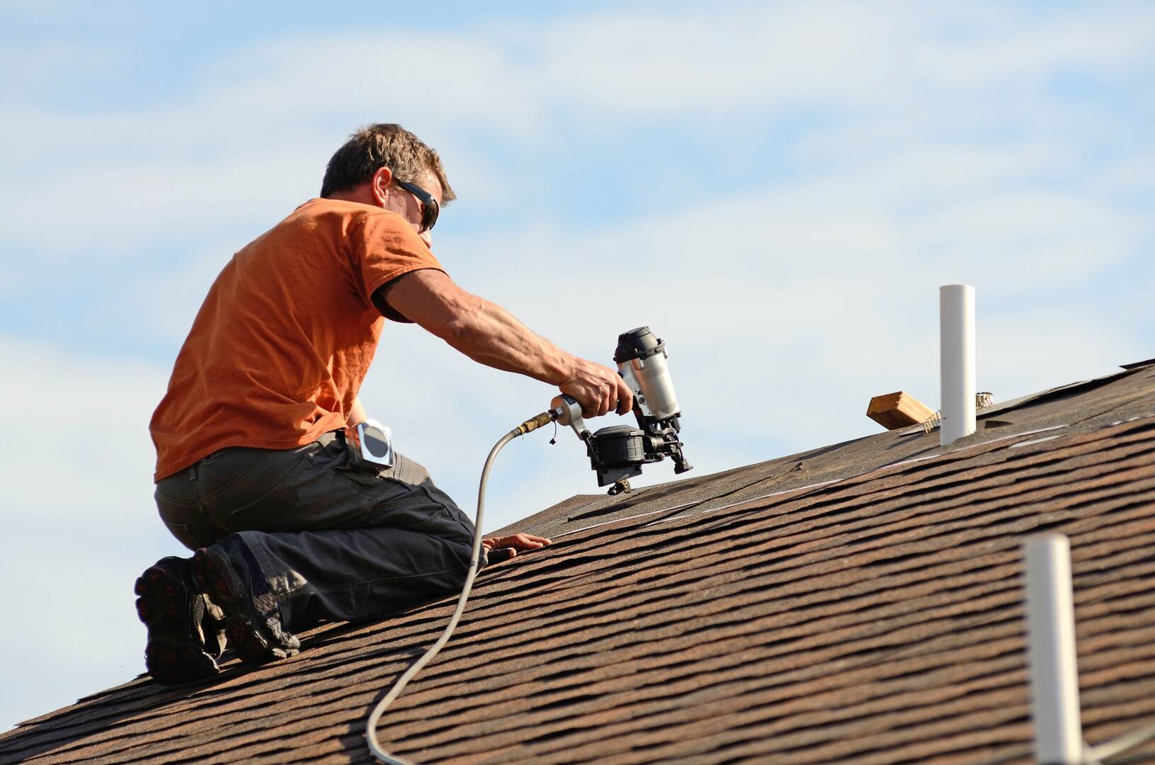 Stutzman Roofing and Construction logo